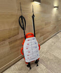 Spearfishing Float Buoy With Foldable Carbon Fiber Flagpole And D Ring Handles Built In Fish Measuring Ideal For Freediving Snorkeling Rescue And Underwater Sports Orange Red in a tiled corridor.