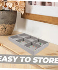 Three Piece Multi Grid Jewelry Organizer Trays featuring earring stands, grey velvet storage tray with bracelets and rings on table.
