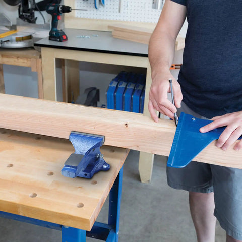 Heavy Duty Table Vise With Swivel Base For Woodworking And Metalworking on workbench holds wood securely in workshop environment