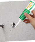 Applying Two Pack Wall Mending Repair Cream With Scraper Quick Crack Fix For Home And Office DIY Patch Paste Easy To Use Self Adhesive to wall hole.