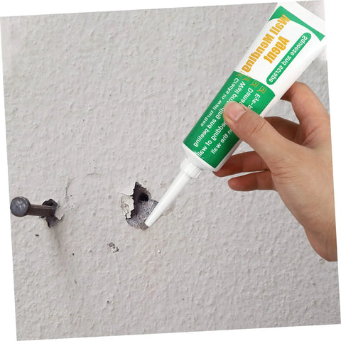 Applying Two Pack Wall Mending Repair Cream With Scraper Quick Crack Fix For Home And Office DIY Patch Paste Easy To Use Self Adhesive to wall hole.