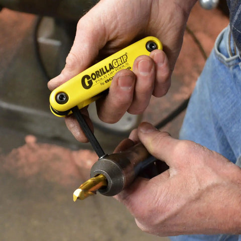 GorillaGrip Fold Up Hex And Torx Set Triple Pack with yellow handle used for tightening metal tool in hand