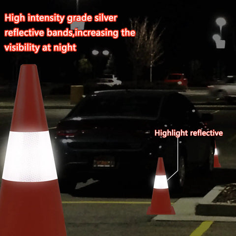 Top Notch High Visibility 15 Inch Traffic Cones With Reflective Collars Four Pack Orange Safety Cones in a parking lot at night
