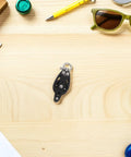 Rugged Nylon Boat Pulley Wheel With Bearing For Sailing Rigging And Kayak Gear displayed on a wooden desk.