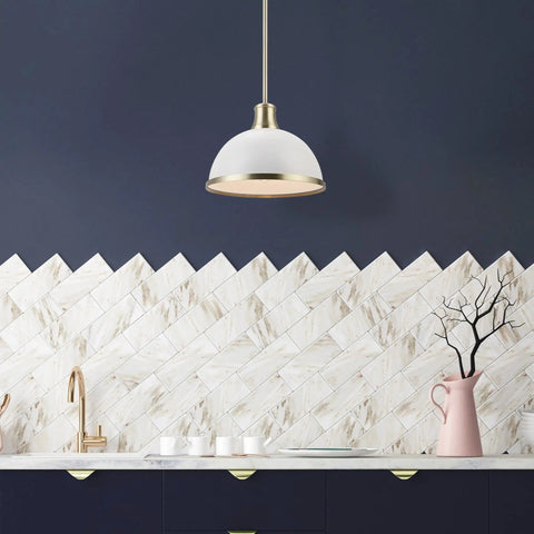 Dope Modern Glam 1 Light Pendant Light with matte white finish and brass accents over kitchen island