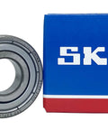 2 Pack 6202-2Z Deep Groove Ball Bearings 15x35x11mm Dual Metal Shield Pre-Greased With Premium GJN Grease beside SKF box