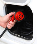 RV Power Cord 30 Amp 25 Foot With 90 Degree Detachable Plug Red Beefy Heavy Duty Cable in hand near camper socket