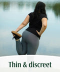 Woman stretching by a lake wearing Fresh Protection Adult Incontinence Underwear For Women Large 28 Count Disposable Maximum Absorbency Blush Packaging May Vary All Day Everyday Leak Protection