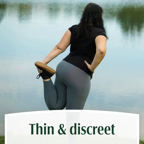 Woman stretching by a lake wearing Fresh Protection Adult Incontinence Underwear For Women Large 28 Count Disposable Maximum Absorbency Blush Packaging May Vary All Day Everyday Leak Protection