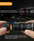 Hands disassembling Tiny But Mighty EDC Flashlight Rechargeable 1300 Lumens, Pocket Size, Keychain Friendly, IPX8 Waterproof