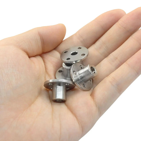 Four Pack 5mm Rigid Flange Shaft Coupling Connector Built With Badass Steel Grip For Diy Projects And Remote Control Cars Super Tough Motor Shaft Joints in hand.