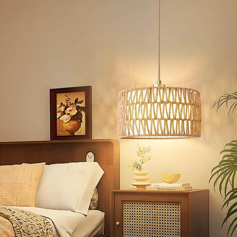 Level Up Your Chill Zone With This Hand Woven Rattan Plug In Pendant Light Farmhouse Hanging Lamp from a bedside view.
