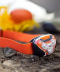 Orange Nautical Safety Kit For Paddle Sports And Boating with waterproof headlamp and floating rope on ground