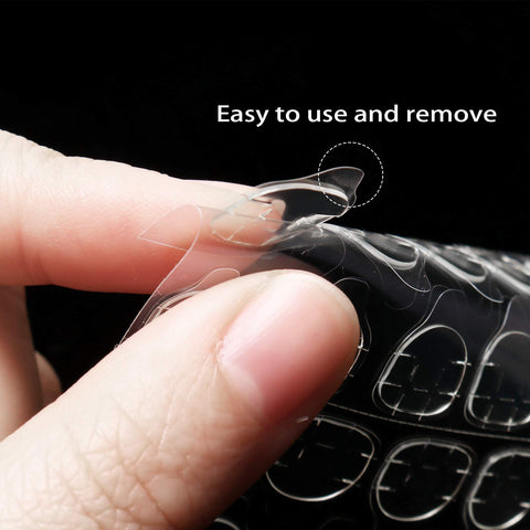 Close-up of hand peeling adhesive tab from sheet, Pro DIY Nail Kit With 288 Double Sided Adhesive Nail Tabs 12 Sheets Waterproof