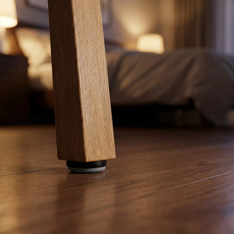 Close-up of a chair leg with 12 Piece Nail On Chair Leg Sliders For Hardwood Floors Heavy Duty Plastic And Metal Floor Protectors.