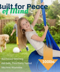 Girl smiling in blue Indoor Outdoor Sensory Pod Swing Chair in garden, supports up to 300 lbs, for Aspergers Autism ADHD SPD therapy.