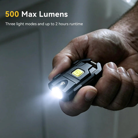 Ultra Bright 500 Lumen USB Rechargeable Small Flashlight Keychain Light held in hand illuminating