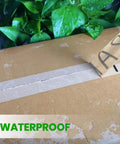 Heavy Duty Kraft Paper Packing Tape For Moving And Shipping, Eco Friendly Biodegradable, shown sealing a wet cardboard box