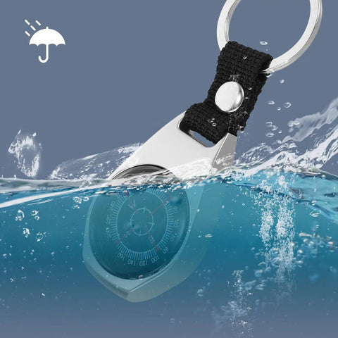 Mini Zinc Alloy Compass Keychain Set for Outdoor Adventures shown underwater, highlighting durability and compact design.