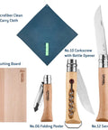 Nomad Camping Kitchen Utensil Kit with No 12 serrated knife, cutting board, No 10 corkscrew, No 6 peeler for outdoor prep.