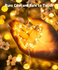 Hand holding Warm White 99 Feet 300 LED Fairy String Lights With Flexible Waterproof Silver Wire forming heart shape