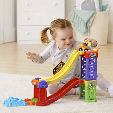 Toddler playing with Go Smart Wheels 3 In 1 Launch Raceway Build Dual Race End To End Super Race And Side By Side Stunt Track Modes