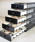 Boss Level Coffee Pod Drawer in Black Satin finish with 5 open tiers holding up to 90 K-Cup pods on a countertop.