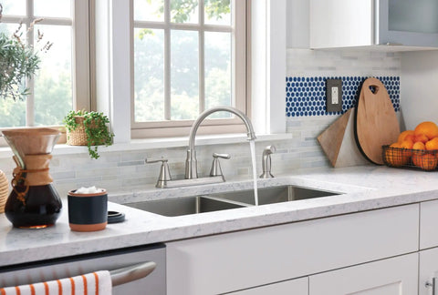 Modern kitchen with Hutchinson Spot Resist Stainless 2-Handle High Arc Kitchen Faucet With Side Sprayer, sleek countertop, window view.