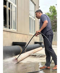 Man using Heavy Duty Sewer Jetting Machine For High Pressure Pipe Cleaning, 60m Hose Jetter System For Municipal And Commercial Pipelines