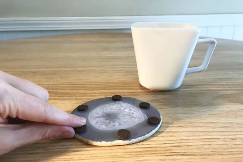 Placing Self Adhesive Felt Furniture Pads One Half Inch Brown 24 Pack Easy Peel And Stick Scratch Protection on table coaster