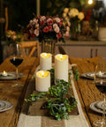Remote Controlled Flameless LED Candles With Timer For Weddings And Parties on a rustic table setting with wine glasses and flowers