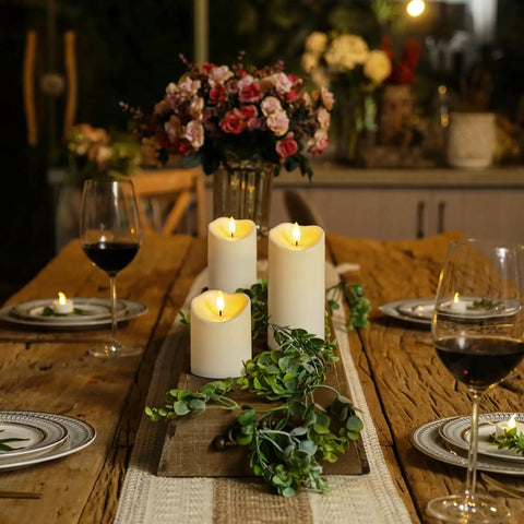 Remote Controlled Flameless LED Candles With Timer For Weddings And Parties on a rustic table setting with wine glasses and flowers