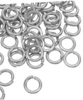 Hella Tough Stainless Steel Spring Lock Washers Assortment Kit with heavy-duty split lock washers scattered on a surface.