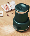Dual Mode Electric Mug Warmer And Cooler Keeps Your Coffee Ice Cold Or Piping Hot Desktop Aluminum Heater Chiller Usb Powered Non Slip Mat For Daily Grind Green on wooden table with dessert.
