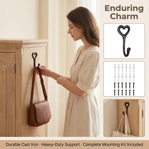 12 Pack Heavy Duty Cast Iron Coat Hooks Wall Mounted Black Workhorse Wall Storage For Coats Bags Built Tough For The Daily Grind With A Sleek Flat Black Finish That Lasts In Any Room on a wooden cabinet holding a handbag.