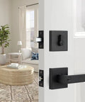 Matte Black Front Door Lock Set Three Pack With Single Cylinder Deadbolt And Keyed Entry Lever installed on white door.