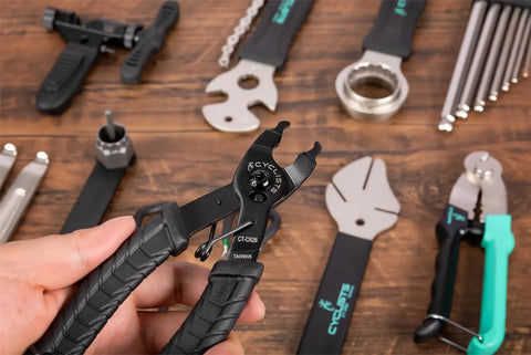 Close-up of bike pliers and tools from Portable 35 Piece Bike Repair Tool Kit With Storage Case For Road And Mountain Bikes