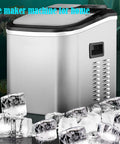 Game Changer Countertop Ice Maker With Self Cleaning Cycle Portable Cube Machine For Kitchen Counters And House Parties in silver, surrounded by ice cubes.