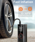 Portable Tire Inflator Air Compressor 150 PSI Cordless Pump With LED Light inflating a car tire on sandy ground