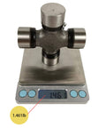 5-178X U Joint Kit 1350 Series OSR Replacement on scale weighing 1.461 lb, showcasing bearing cap design and measurement.