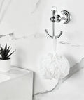 Heavy Duty Polished Chrome Crystal Wall Hook Top Shelf Bathroom Robe Hanger for hanging a white mesh loofah.