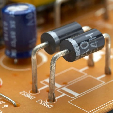 Close-up of diodes on a circuit board from Diode Assortment Kit For Electronics Hobbyists And Makers Featuring 1N4001 Through 1N4007.