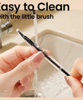 Cleaning brush from Glass Dropper Set With 10 Pieces Featuring 8 1ml Droppers And 2 Cleaning Tools under tap