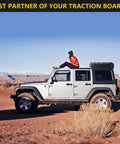 SUV with Lockable Mounting Pins For MKII Recovery Traction Boards 4 Pack secured on roof in desert terrain.