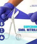 Built Tough 5 Mil Thick Nitrile Exam Gloves In Sharp Cobalt Blue Disposable Latex Free Protective Handwear For Health Professionals Emt Teams And Food Prep Straight Up Mega Bundle Of One Thousand Count being stretched with scissors.