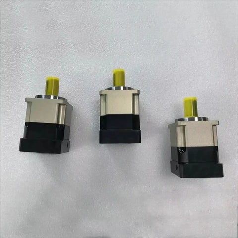 Three High Performance Hard Tooth Planetary Gear Reducers showcasing robust design and yellow shafts for heavy duty speed reduction projects.