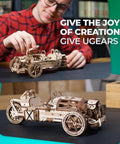 Three Wheeler UGR S DIY Wooden Model Kit With Spring Motor, Functional Steering, Chain Drive And Front Rear Suspensions, 3D Puzzle For Adults, Hands On Hobby Build To Impress Friends. Wooden UGR-TR model car with spring motor on a table