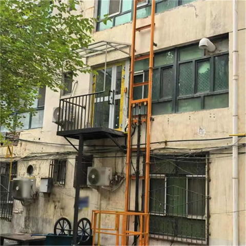 Heavy Duty Lift Platform With Guide Rail For Smooth Hydraulic Vertical Freight Elevator mounted on building for material handling.