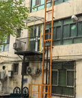 Heavy Duty Hydraulic Lift Table With Guide Rail Vertical Elevator Platform Built Like A Tank For No Sweat Industrial Hauling And Smooth Single Person Control mounted outside building.