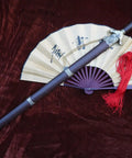 Tai Chi Training Sword With Dope Stainless Steel Flexible Blade 28 Inch Blade 39 Inch Overall Hand Made Heat Tempered Longquan Style Rosewood Scabbard And Handle Ideal For Martial Arts Practice next to closed fan